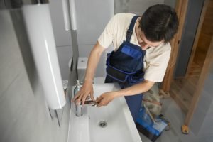 male-plumber-working-fix-problems-client-s-house